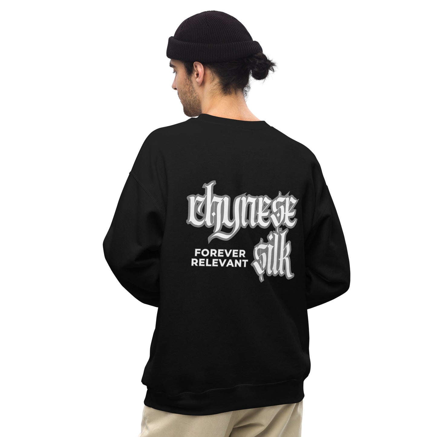 Male model viewed from the back wearing a black premium Chynese Silk Gothic Revival streetwear sweatshirt, displaying the large white typography logo.